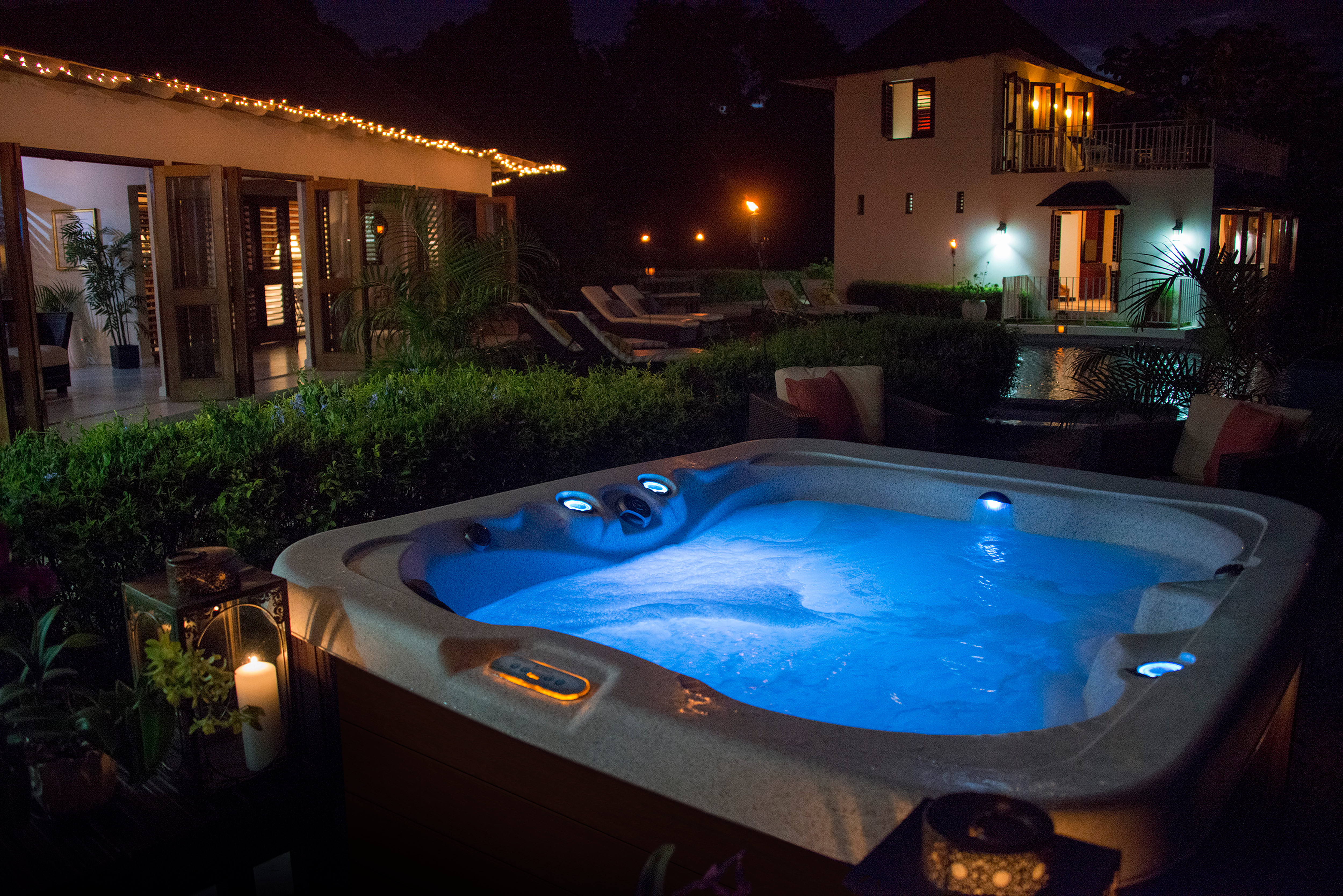 Twilight Series hot tub glowing at dusk