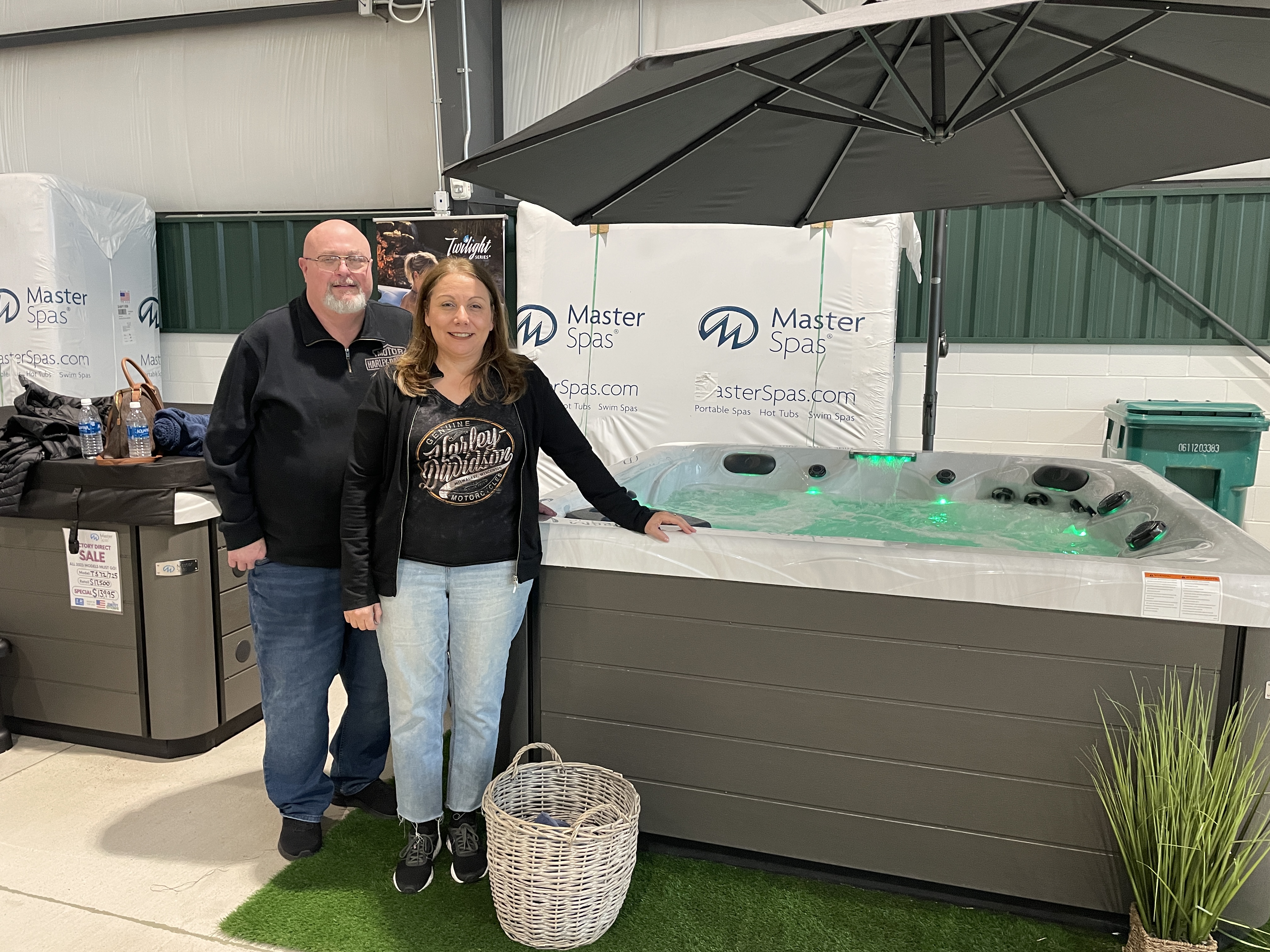 Customers celebrating their Twilight Series purchase in the showroom
